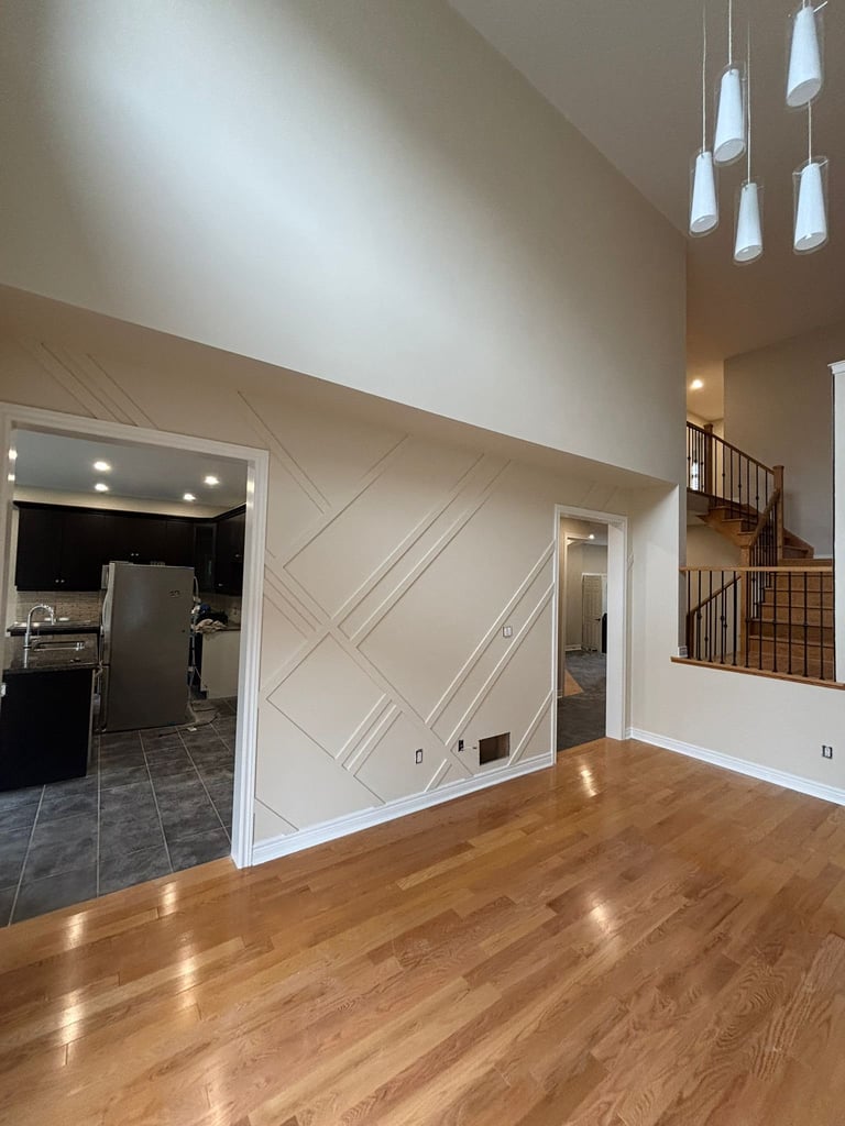 Modern open-concept living space with polished hardwood floors